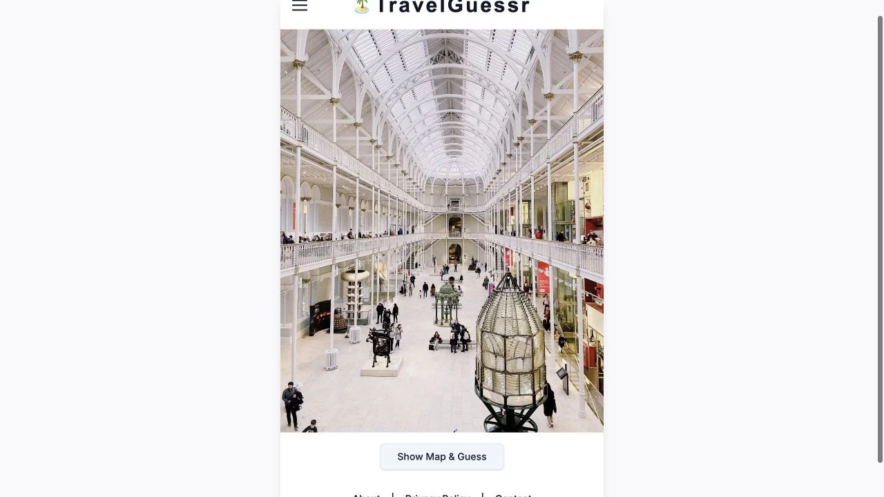 TravelGuessr — current daily travel photograph and show map & guess control